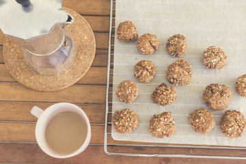 homemade oat cookies, coffee cup and moka pot