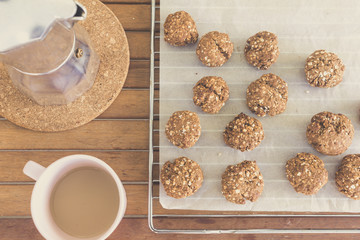 Fototapeta na wymiar homemade oat cookies, coffee cup and moka pot