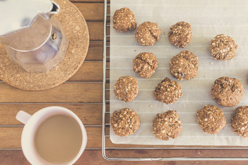 homemade oat cookies, coffee cup and moka pot