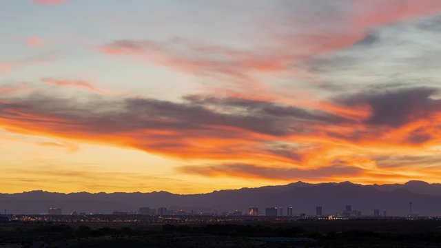 Sunset time lapse of the beautiful strip skyline with red clouds