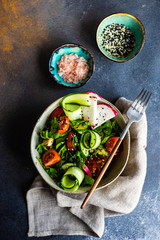 Healthy vegetable salad on rustic background