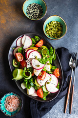 Healthy vegetable salad on rustic background