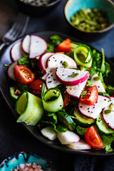 Healthy vegetable salad on rustic background