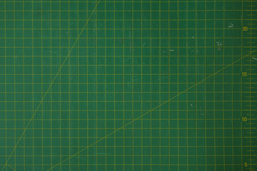 green cutting mat scale with scratch texture from cutter