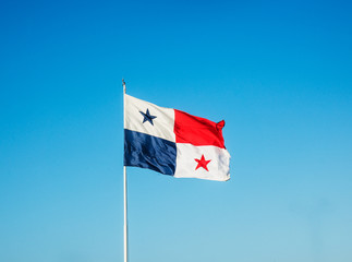 Panama flag against a blue sky, Panama City, Panama, Central America 