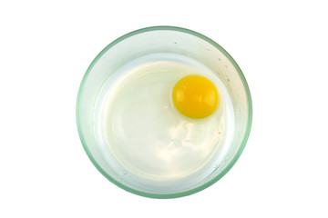 top view of chicken egg yolk in glass bowl