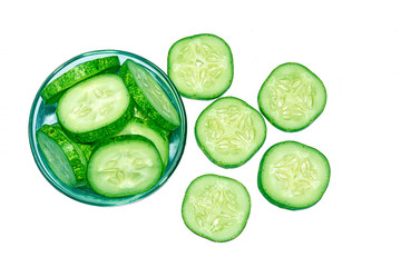 Slices of fresh green cucumber on white background.