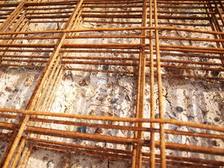 Closeup - steel reinforced concrete on the ground, reinforcing bars for road construction at construction sites. Selective focus