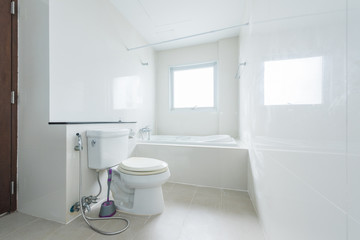 Fototapeta na wymiar White toilet clean and simple bathroom