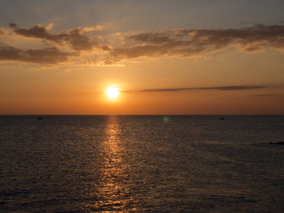 Naklejka na ściany i meble Beautiful sunset sky over the ocean, natural background