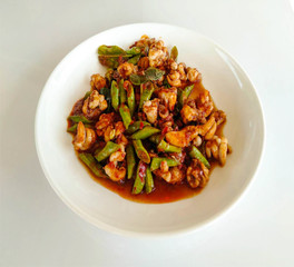 Stir Fried Squid with Chili Paste Put yardlong beans in a white plate.