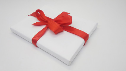 White Christmas Gift with Red Ribbon and Decoration Isolated on White Background