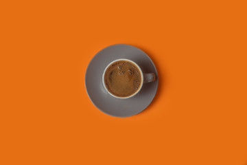 Black coffee isolated on orange background 