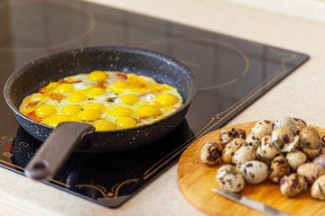 Lunch, breakfast, fried eggs from quail eggs fried in a pan