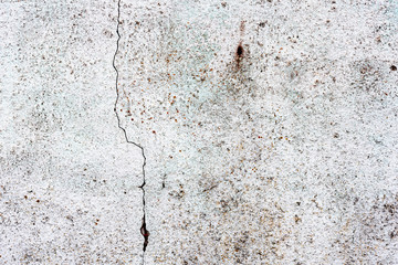 Texture of a concrete wall with cracks and scratches which can be used as a background