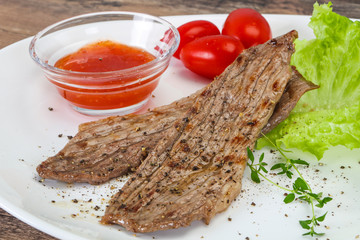 Grilled Thick pork steak served salad