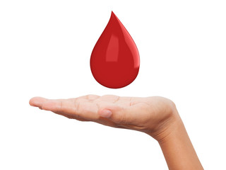 Red blood drop in hand isolated on white background.