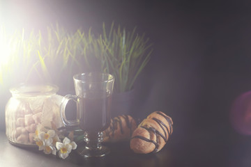 French breakfast on the table. Coffee croissant with chocolate and a decanter with cream. Fresh...