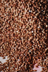 A set of grain cereals. Rice, buckwheat and millet groats in a wooden tray. A grocery set of cereals. Import of grain.
