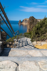 Fototapeta na wymiar A new stone staircase of 800 steps to Jasper Beach, built in the spring of 2020. The reserve on the Black Sea. Cape Fiolent, Crimea Peninsula. The concept of unity with nature, outdoor activities.