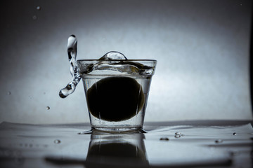 A glass with water and splashes