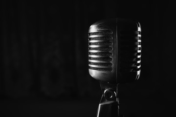 Retro silver microphone on black background