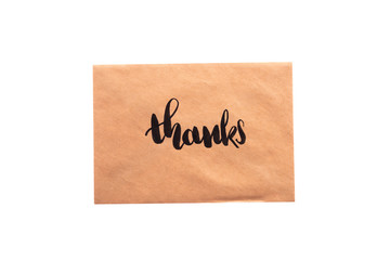 Brown color envelope with hand writing word "Thanks"