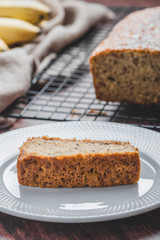 Freshly Baked Banana Cake with Sliced Cake on Plate- Close Up Vertical