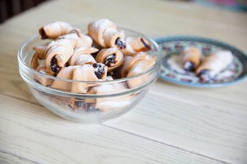 Fresh sweet crescent rolls with jam.
