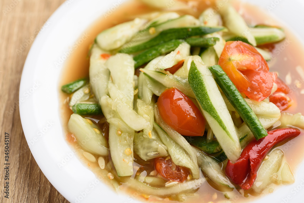 Canvas Prints spicy cucumber salad on white plate, delicious thai food