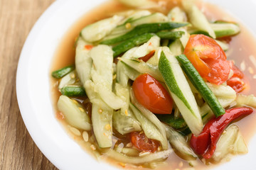 Spicy cucumber salad on white plate, Delicious Thai food