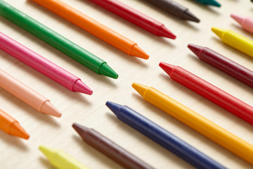 Colorful crayon on wooden table