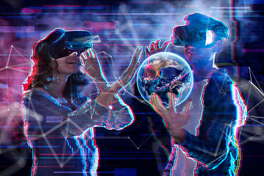 Girl and boy are playing in virtual reality game club. Young woman and man in VR glasses are gaming with realistic holograms in simulator. Entertainment and leisure concept. Modern technologies.