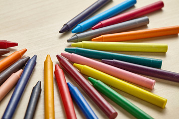 Colorful crayon on wooden table