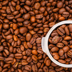 Top view of fresh Roasted arabica coffee beans with the scoop, can be used as a background, Macro of coffee bean.