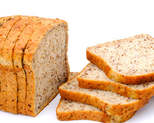 closeup of sliced wholegrain bread on white background, 
Top view with copy space. Yummy and healthy concept.