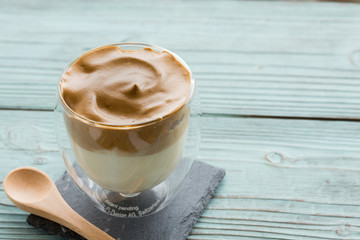 Whipped dalgona coffee on a wood background - ダルゴナコーヒー