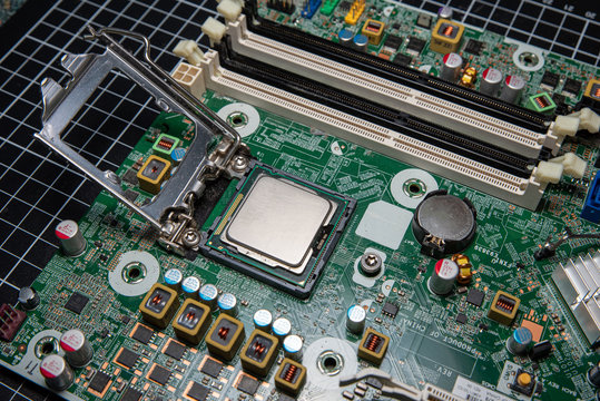 cpu installation on a computer , green motherboard