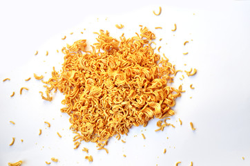 Uncooked instant noodles on a white background. This food is suitable for the Covid-19 pandemic.