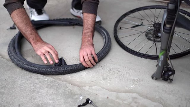 Inflating a bicycle tire with a pump