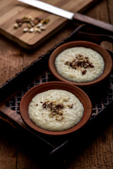 Phirni, a traditional and delicious indian style milk and rice based creamy dessert, served in clay pot
