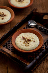 Phirni, a traditional and delicious indian style milk and rice based creamy dessert, served in clay pot