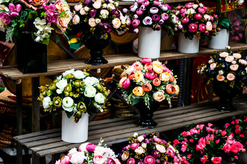 Fototapeta na wymiar Beautiful bunches of flower for decorations and ceremonies in a shop in the old town of Hanoi, Vietnam.