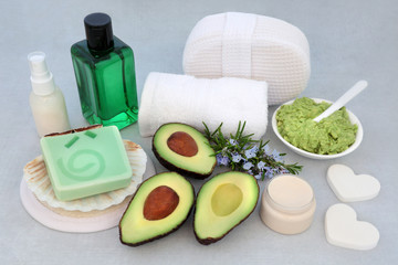 Fototapeta na wymiar Natural vegan beauty treatment for skincare with avocado face mask, rosemary herb, ex foliation mineral salts, moisturising cream & lotion with cleansing products.