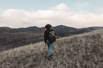 young man walking in the mountains