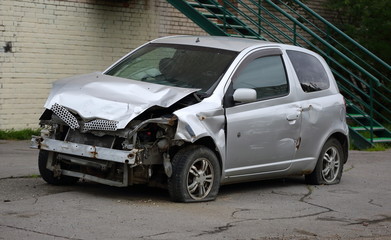 Fototapeta na wymiar Broken car silver color after the accident