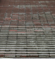 Long high staircase with rough stone steps