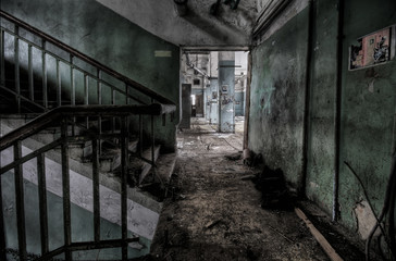 Old staircase in a scary abandoned empty building