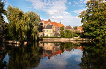 Fototapeta na wymiar Ancient castles on the lake of love in Bruges