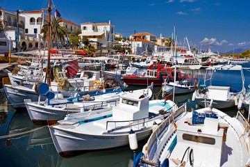 Fototapeta na wymiar Fishing boats in the old harbor of Spetses island, Greece, September 24 2015.